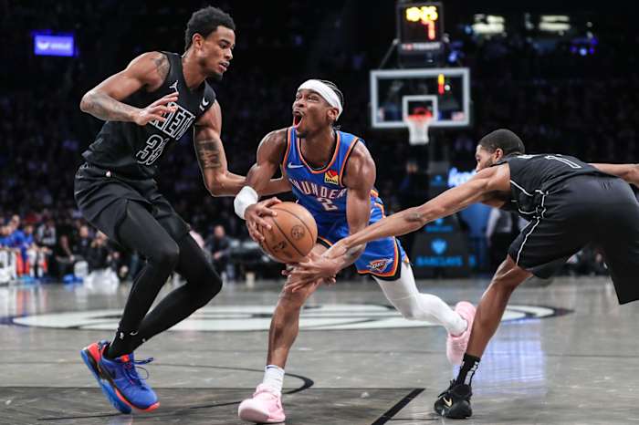 Oklahoma City Thunder guard Shai Gilgeous-Alexander (2) drives against Brooklyn Nets center Nic Claxton (33